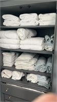20+ large white towels, washcloths, etc. cabinet