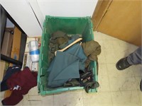 Tote of assorted uniforms.