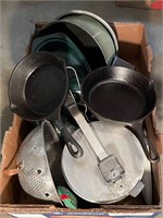 Large box with 2 cast iron skillets and cookware