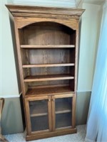 Solid Wood bookcase with glass doors.