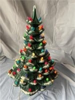Ceramic Christmas tree. Plays jingle bells. Has