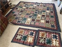 Handmade quilt, and appears to be hand quilted.