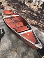 Playbuoy canoe with two seats. In red