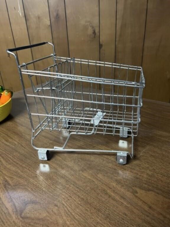 Miniature shopping cart on working wheels