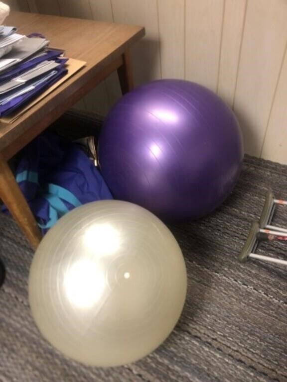 Two exercise balls, seem to have no holes, purple