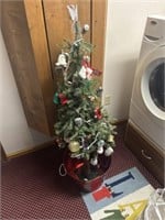 Christmas tree and bucket