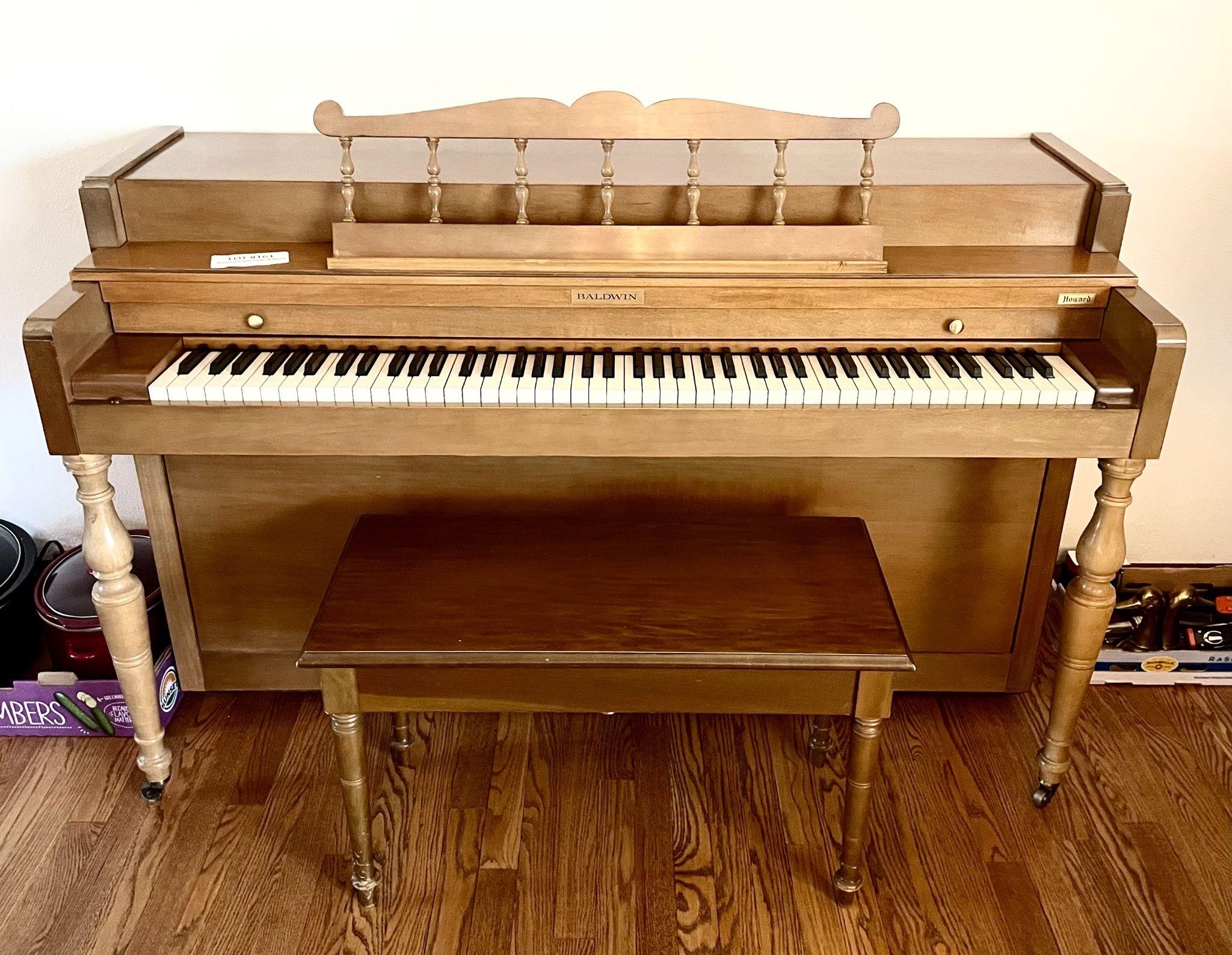 Baldwin Howard spinet piano, bench, and music