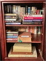 Group of books in cabinet
