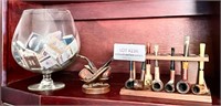Pipes, pipe holders, large snifter with matchbooks