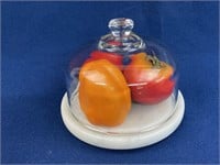 Cheese dome with marble base, has plastic fruit