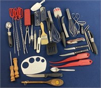 Assorted kitchen utensils including knives,