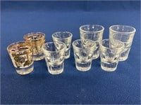 (8) Assorted shot glasses 2 1/4”-3”