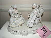 PORCELAINE CELLO PLAYER AND LADY FIGURE