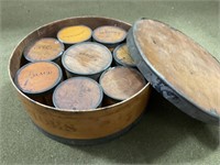 Wooden spice canisters in a wooden drum