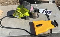 Electric Chainsaw Sharpener and a Manual Chainsaw