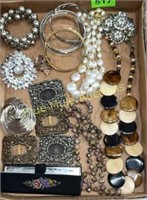 Necklaces, bracelets, brooches, comb