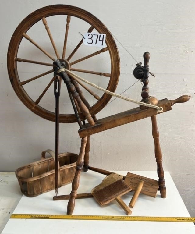 Antique spinning wheel, with carting paddles.