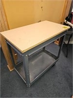 Metal work table on casters