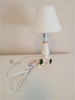 Small off white table top lamp with a white