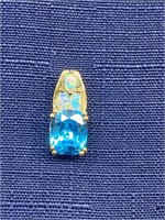 Sterling silver pendant with blue topaz and opal