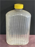 2 quarts Clear water bottle yellow top vintage