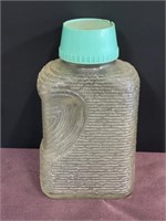 Clear glass vintage water bottle teal green