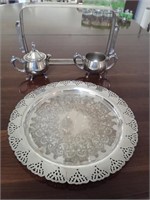 A plate two serving dishes and a