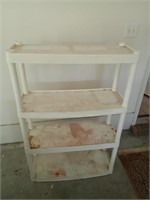 A white plastic shelf 
48x
32x
12