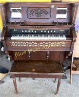 Antique pump organ with bench-working