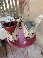 Planters and pink table