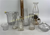 Clear glass milk bottles, oil lamp, pitcher