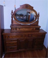 Oak 11 drawer dresser w/ beveled mirror,