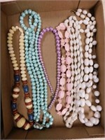7 plastic and wood bead necklaces