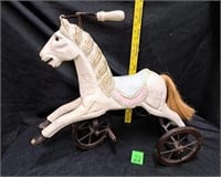 child's wooden horse riding toy