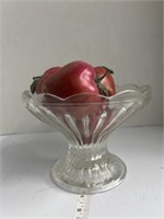 Glass fruit display with plastic apples