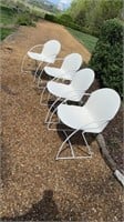 4 white outdoor chairs