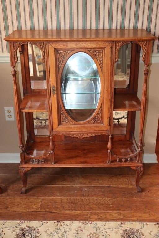 Antique parlor cabinet with beveled glass door