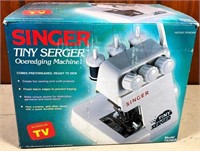 lightly used- SINGER tiny Serger