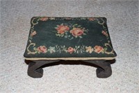 Foot stool with floral decorated upholstered top