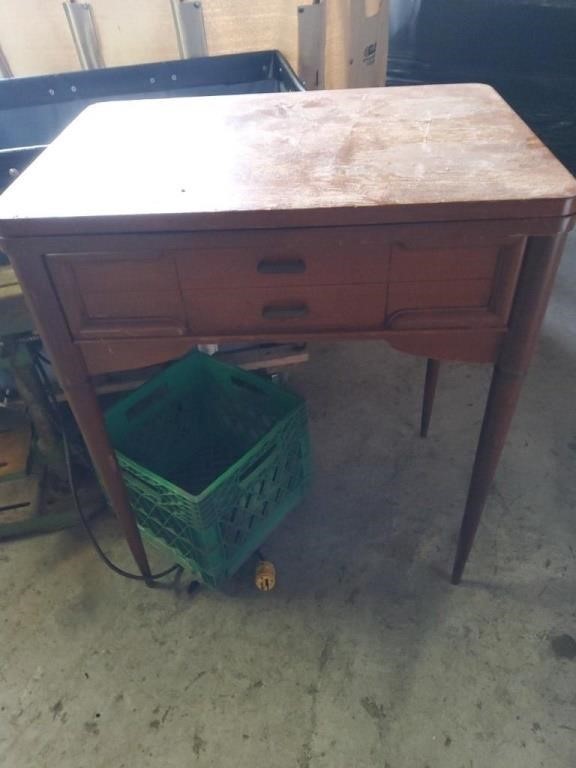 Brown wooden sewing table