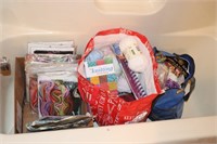 Bathtub contents - needlepoint kits, yarn, knisty