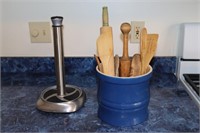 Stoneware utensil holder with wooden utensils,