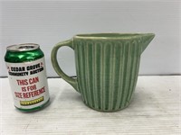 Pottery green pitcher small chip on side refer to