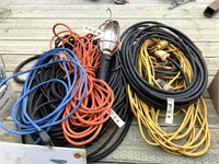 2 Piles of Extension Cords & Trouble Light