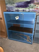 Blue shelf with glass sliding doors