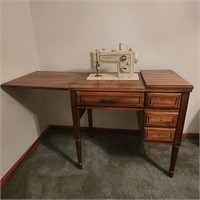 Kenmore, sewing machine and cabinet 32X21X31.