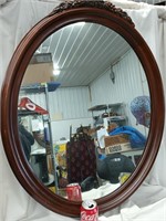Oval Kindle hanging mirror for a dresser or