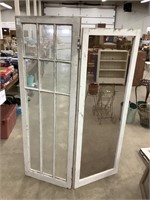 Two unique hinged window pieces with screens on