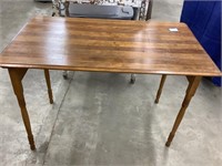 Table with folding legs for storage.  26 x 37.5 x
