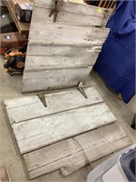 Two rustic barn doors with hinges